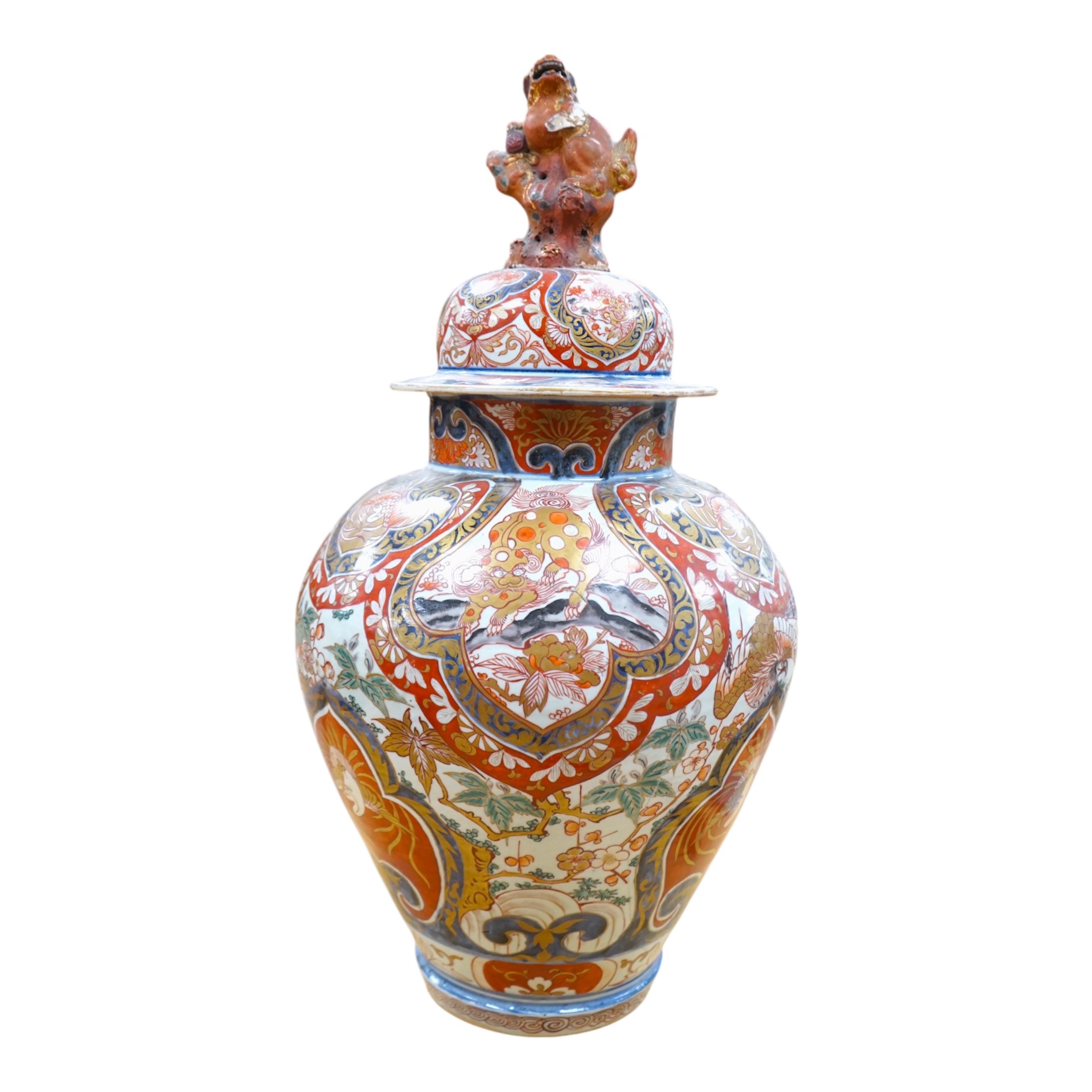 A large 19th century Imari vase with dragon finial to cover, 61cm high. Condition - badly cracked and restored